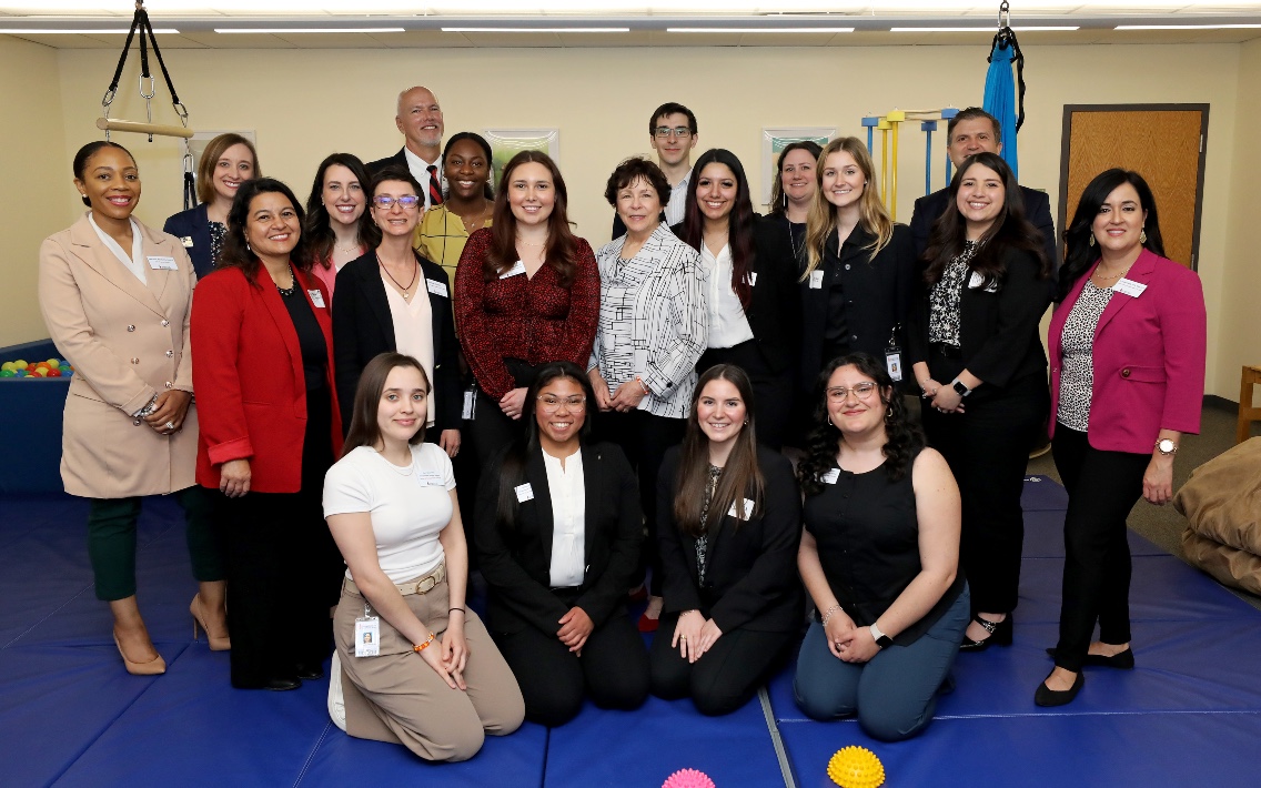 Students and staff from University of Incarnate Word and Deputy Assistant Secretary Ruth Ryder in a group photo in the sensory gym at the University of the Incarnate Word.