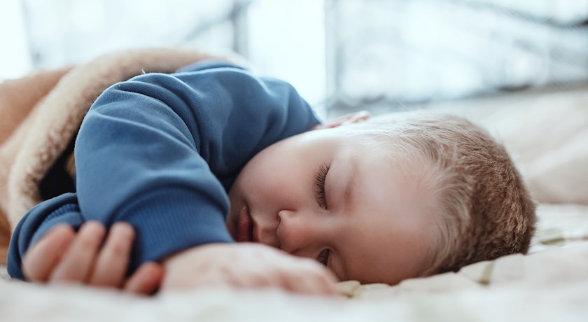 Child toddler sleeping in bed