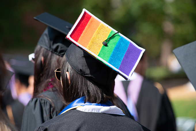 lgbtqia-back-view-of-graduate-with-pride-flag-on-cap