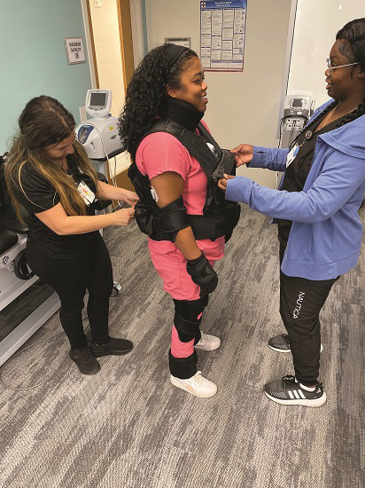 OT students donning the simulation equipment.