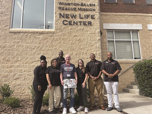 Winston-Salem State University MSOT students pose with a Winston-Salem Rescue program graduate.