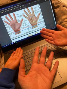 The author studies the structures of the hand for a biomechanics test with her daughter Maya (8) and her son Mathis (4)
